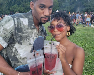 image of a couple enjoying a comegetbuzzed.com cocktail in a 12 ounce pounch