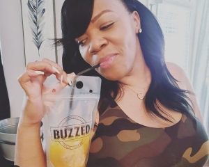 image of woman enjoying a comegetbuzzed.com 12 ounce pouch