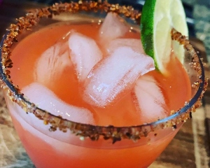image of comegetbuzzed.com's bachanaal punch on the rocks with sugar rim