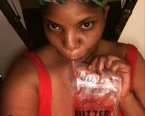 image of woman enjoying a comegetbuzzed.com 12 ounce pouch